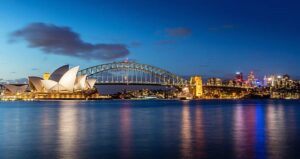 Sydney, Australia - September 5, 2013: Beautiful Opera house view at twilight time with vivid sky and illumination on the bridge